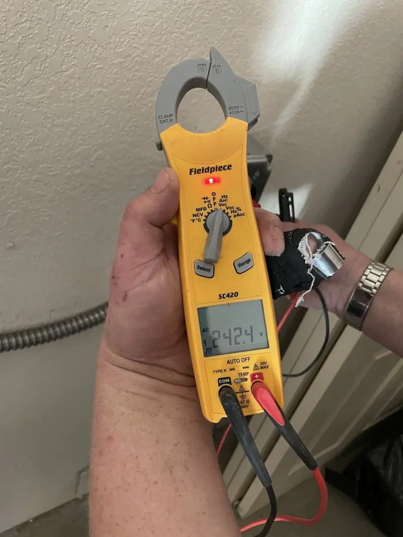 Voltage testing with clamp meter during Recessed Lighting Installation in Port Townsend